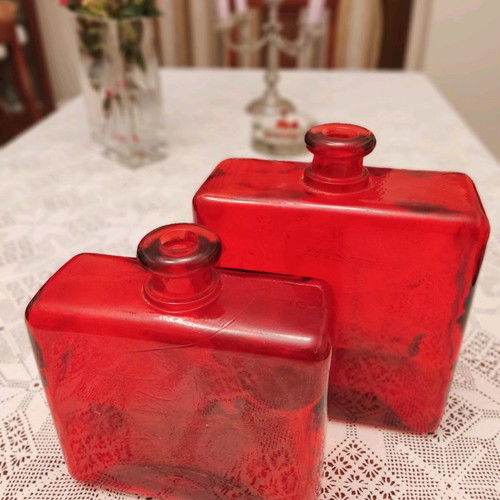 Set of two used decorative red glass vases made in Spain