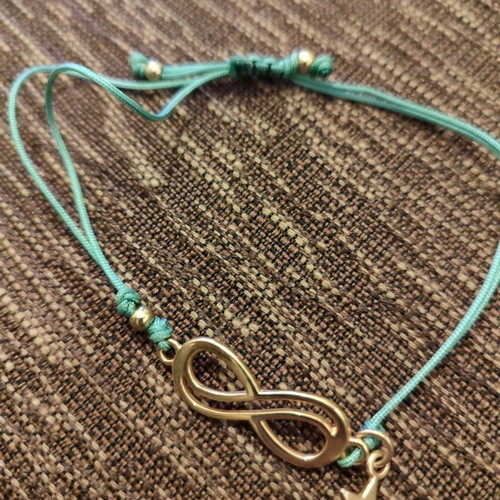 Bracelet new with gold infinity and star element, turquoise