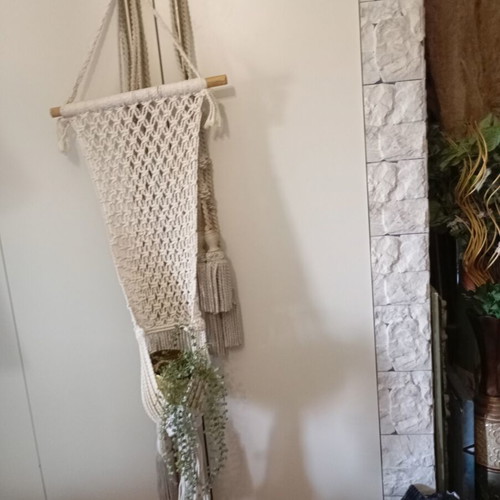Two knitted wall hangers for pots, different sizes