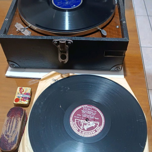 His Master's Voice portable gramophone used with accessories