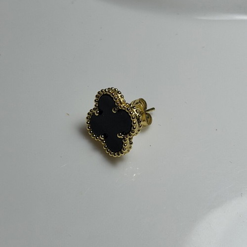 Steel earring black and gold, like new, single piece