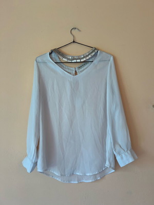 White blouse with silver details around neckline size M like new
