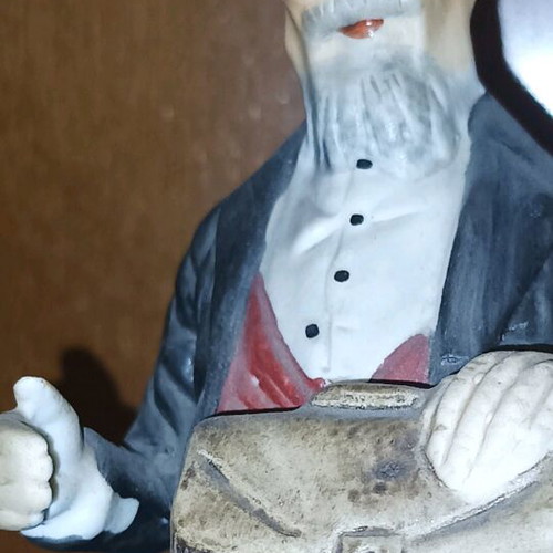 Vintage decorative figurine like new with seated old man