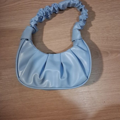 Blue leather handbag new with spacious capacity