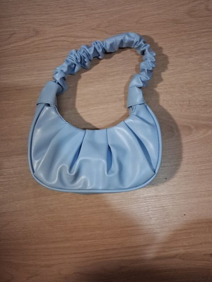 Blue leather handbag new with spacious capacity
