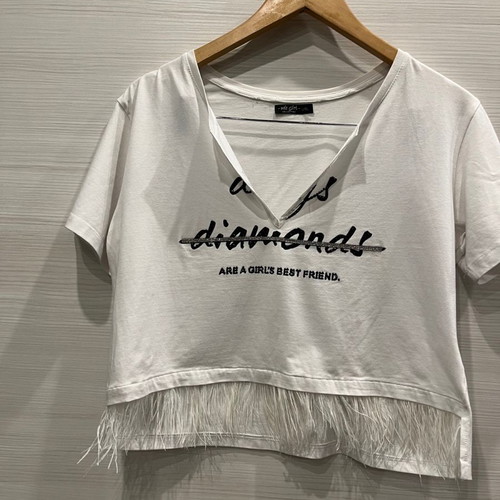 Women's blouse used, white short asymmetric with feathers