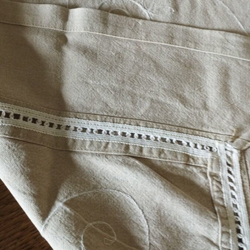 Linen tablecloth like new in earthy soft gray beige with embossed embroidery