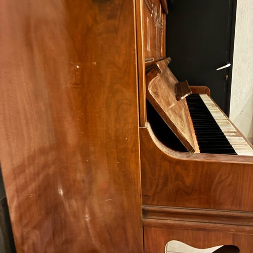 Wooden piano used, antique with key wear