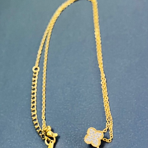 Necklace new with white enamel flower
