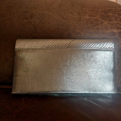 Vintage silver envelope hand bag like new with strap