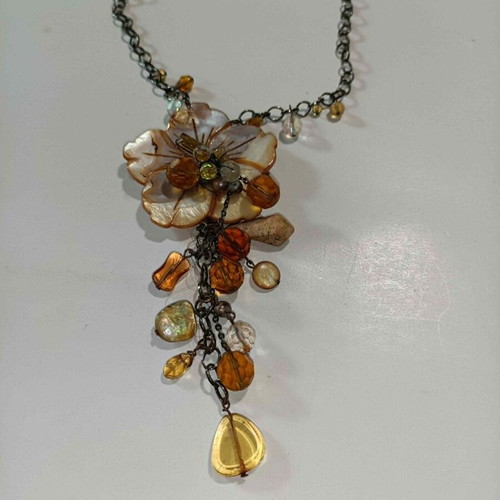 Necklace with flower and beads in beige and honey tones, like new