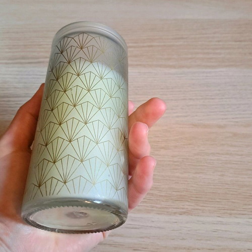 White candle in container new
