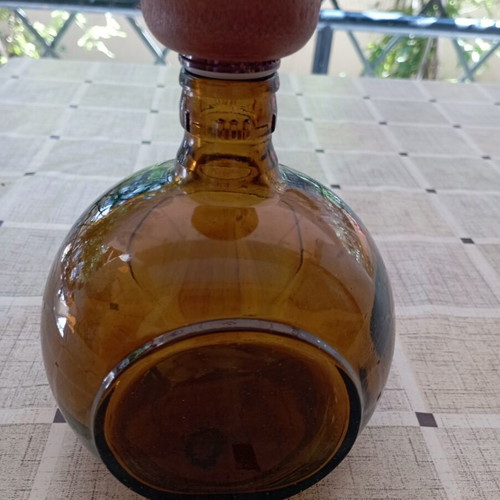 Don Julio Anejo tequila round collectible bottle, amber glass