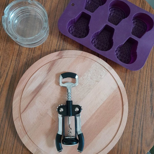 Household utensils like new, cutting board, corkscrew, ashtrays, silicone mold