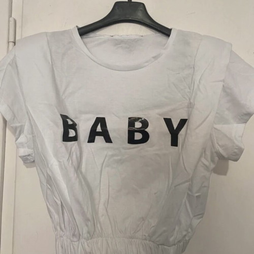 Crop top white with black print, shoulder pads and pleats, new