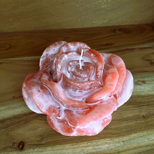 White and pink rose-shaped candle