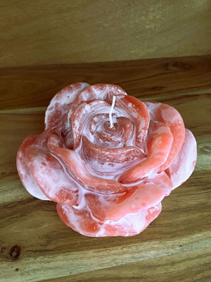 White and pink rose-shaped candle