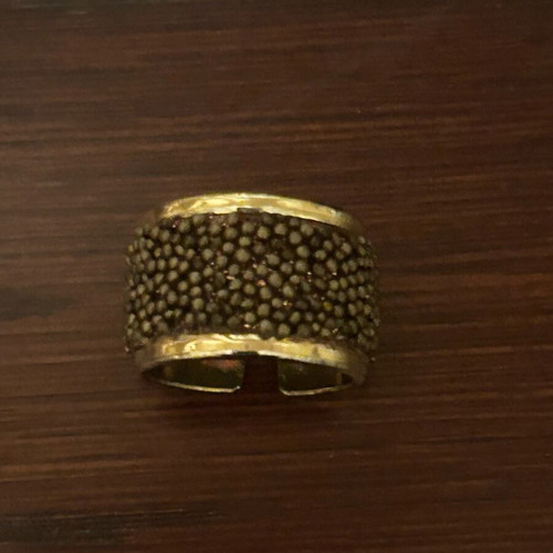 Steel ring gold plated with embossed brown designs like new, adjustable