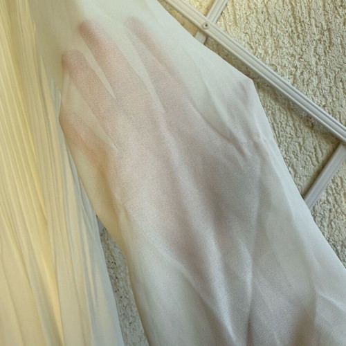 White pleated dress with sleeves in very good condition