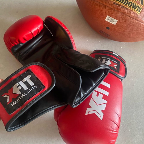 Boxing gloves and rugby ball like new