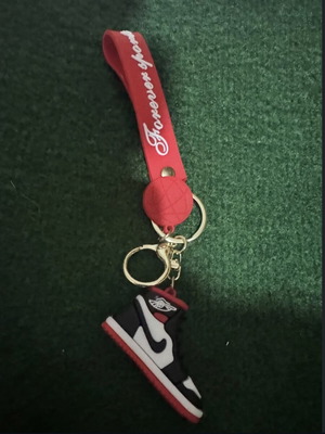 Nike shoe keychain, black and red