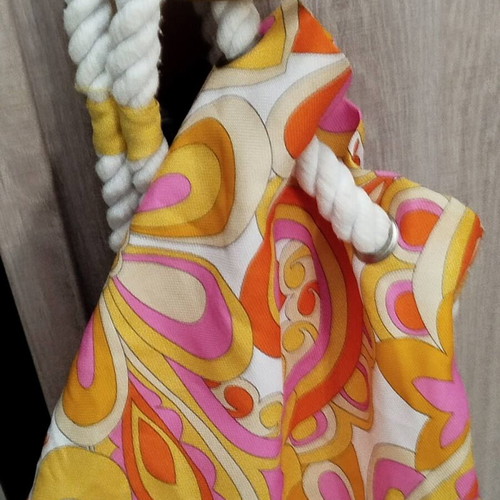 Clinique shoulder bag like new, colorful, cylindrical shape