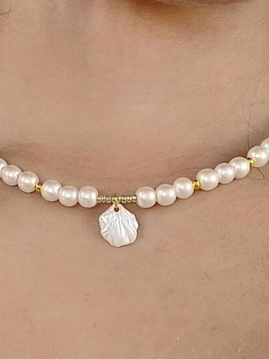 Handmade pearl necklace with gold beads and shell pendant