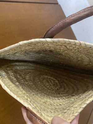 Round woven straw shoulder bag with leather handles