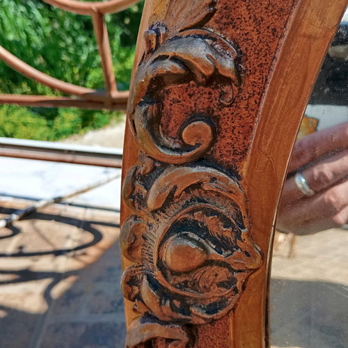 Old carved oval mirror used