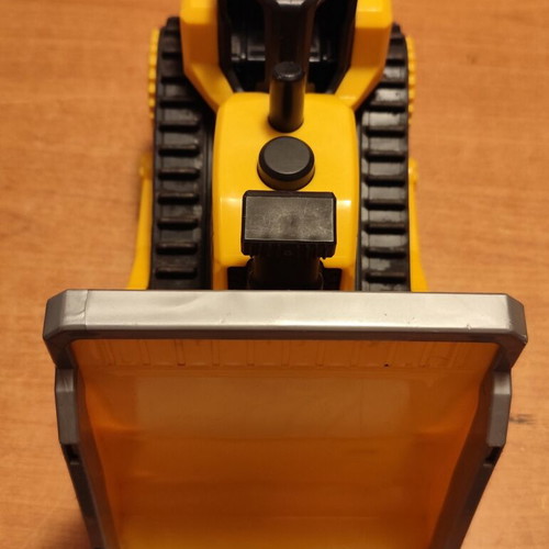 CAT bulldozer toy used with moving tracks and gradual forward-back motion