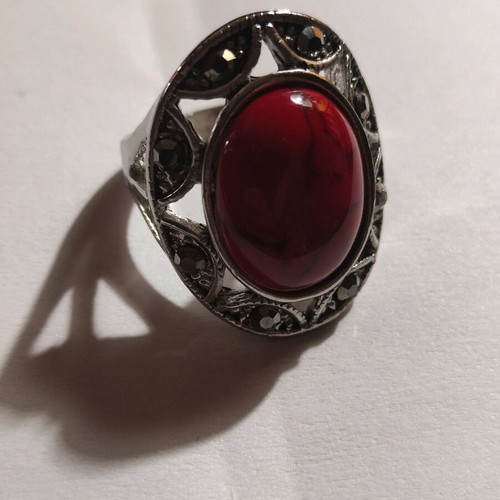 Silver-plated ring with red stone and small crystals new