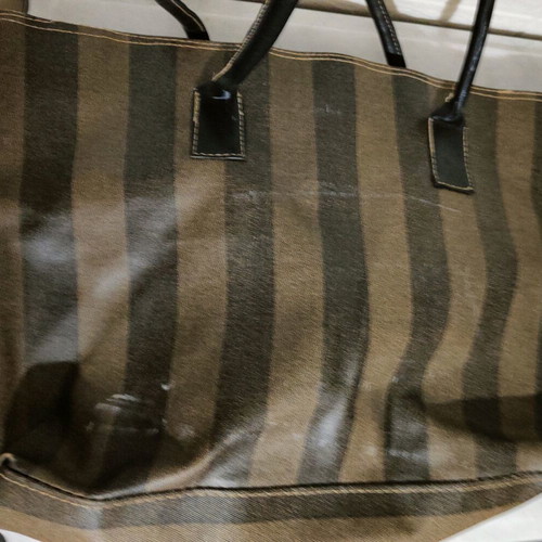 Handbag used with beige-brown stripes, plastic fabric