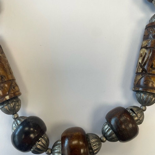 Long necklace with carved wooden and metal beads used, South Africa