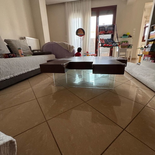 Wooden coffee table like new, dark brown with glass legs