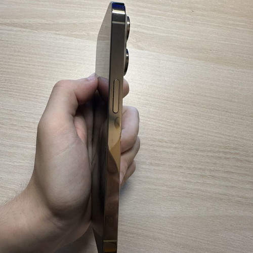 iPhone 14 Pro 128GB used, gold, with two cases, minor back crack