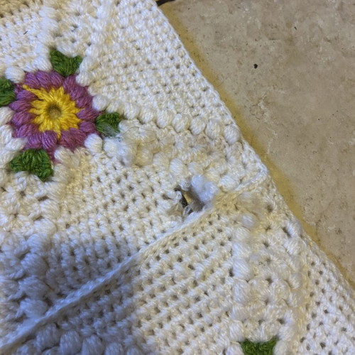 Handmade blanket used with floral crochet design