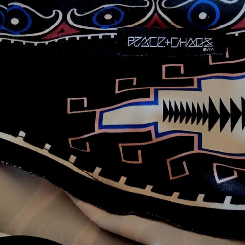 Peace And Chaos mini skirt like new, tribal design, sizes S/M