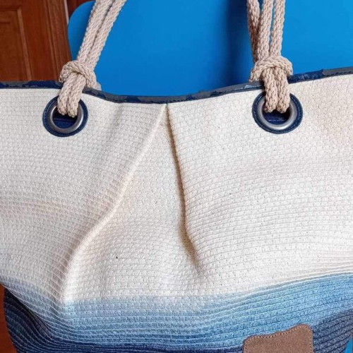 Beach bag used with worn leather