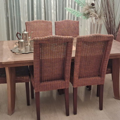 Vintage wooden dining set with rectangular table and six wicker chairs