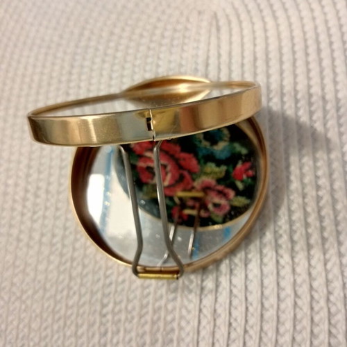 Vintage folding travel mirror with floral design