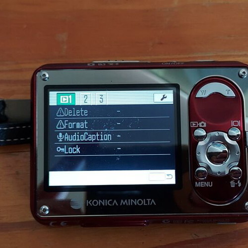 Konica Minolta DiMAGE X1 camera used, complete with charger and Boss strap