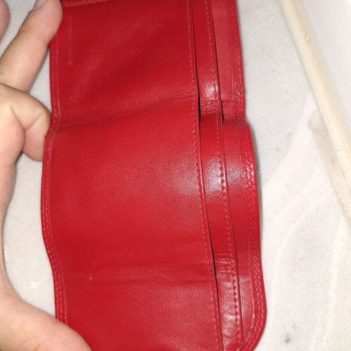 Small red wallet with coin and bill compartments