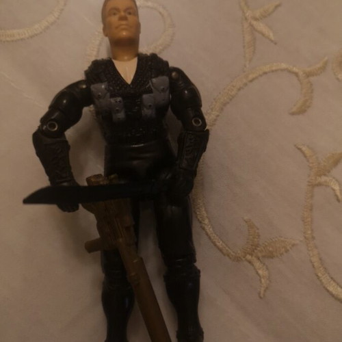 G.I. Joe action figure with weapons