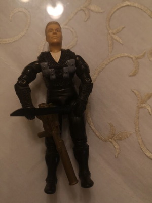 G.I. Joe action figure with weapons