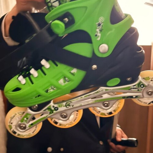 Rollers new, two pairs with knee pads, green-black and white-black