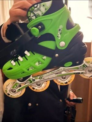 Rollers new, two pairs with knee pads, green-black and white-black