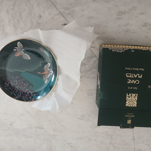 Plates set of 4 new with Chinese design