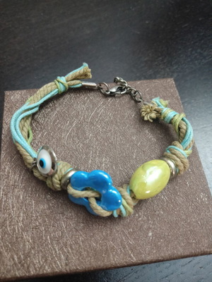 Bracelet with cords, evil eye and porcelain beads like new, colorful