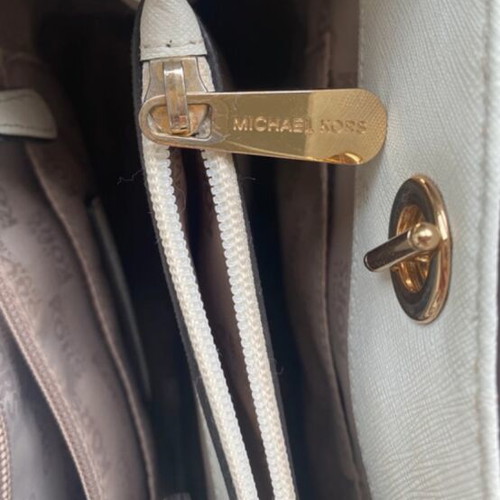 Michael Kors white tote bag with floral and dragonfly details