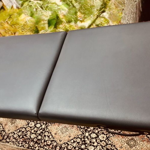 Portable folding massage bed with vinyl mattress, wooden frame
